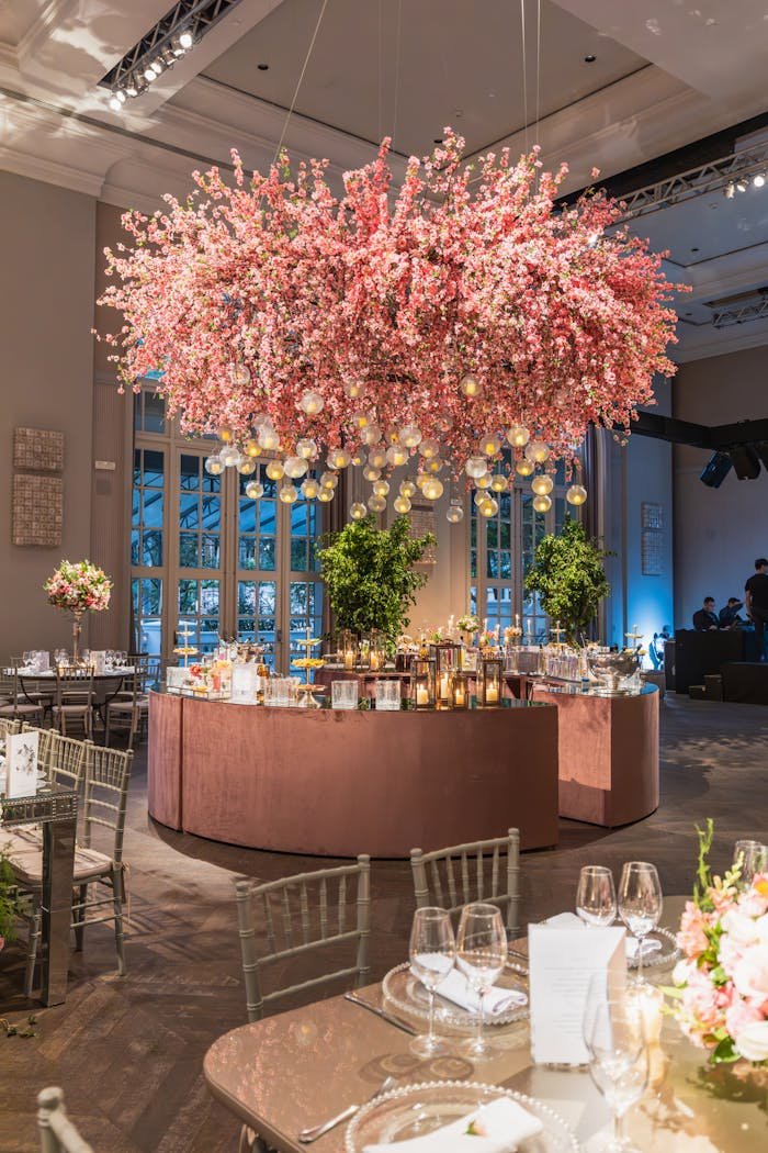 Luxury Banquet Hall with a Chandelier Decorated with Pink Cherry Flowers